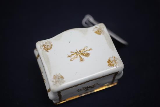 A late 18th / early 19th century French gilt metal mounted commode shaped white enamel snuff box, 3in.